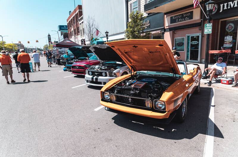 A lineup of current and classic Mustangs on display