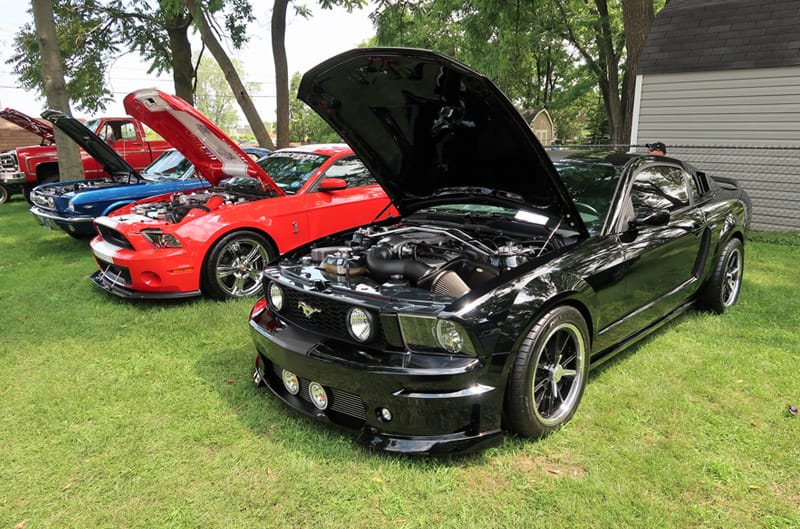 A lineup of classic and current Mustangs on display