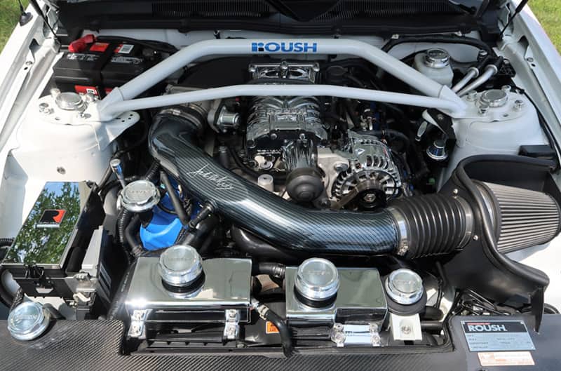 A closeup of a Roush engine inside a vehicle