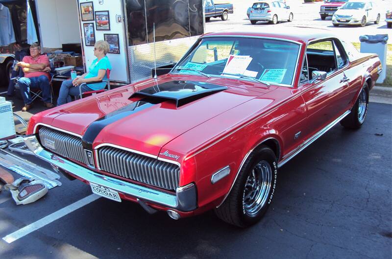 Front of a red Mercury in the parking lot