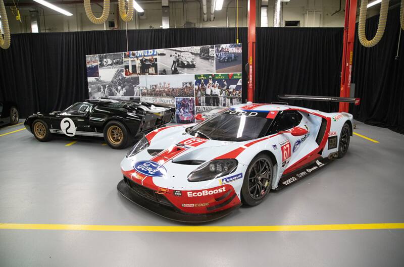 A black GT and a white and red GT on display