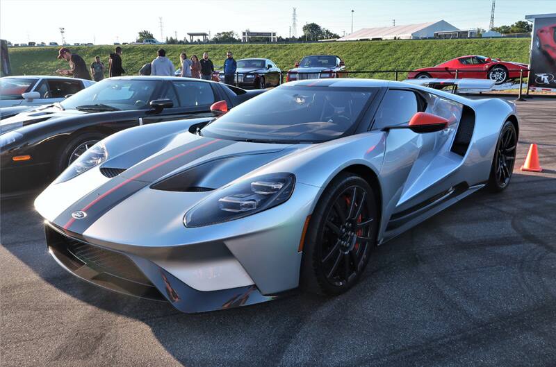 Front of a gray GT with black and red stripes in parking lot