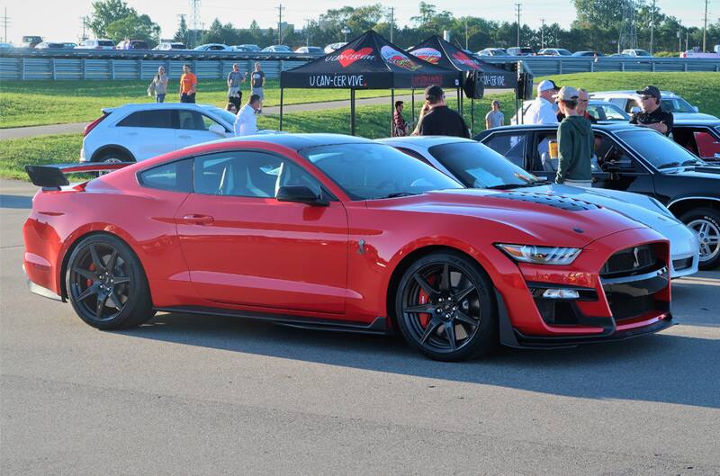 Profile of a red Shelby Mustang in the parking lot