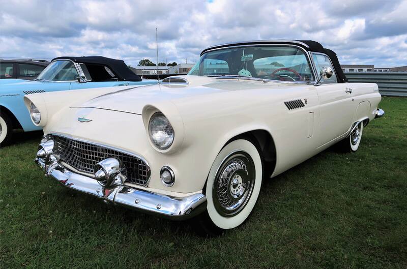 Front profile of a white Thunderbird parked on grass