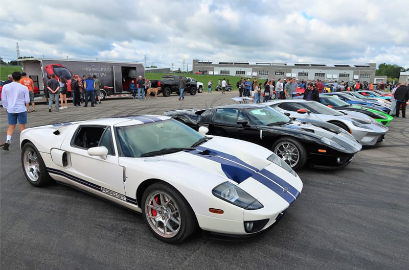 Parking lot full of various Ford GTs