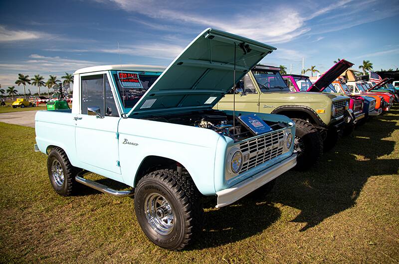 A lineup of classic Ford Broncos on display at the Bronco Corral