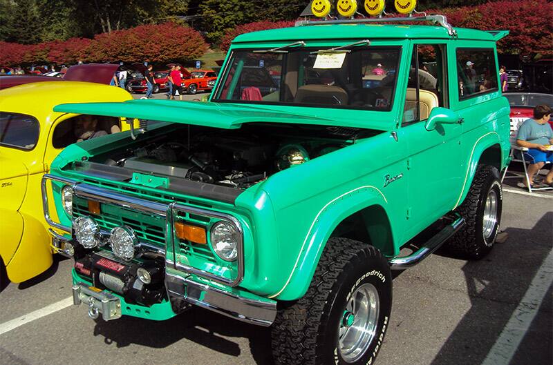A green Ford Bronco on display