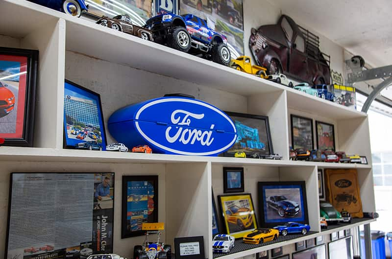 Shelves of diecast Fords and various Ford pictures