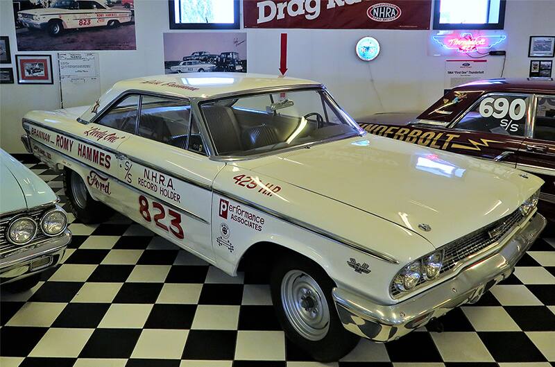 Front profile of a white Thunderbolt in a garage