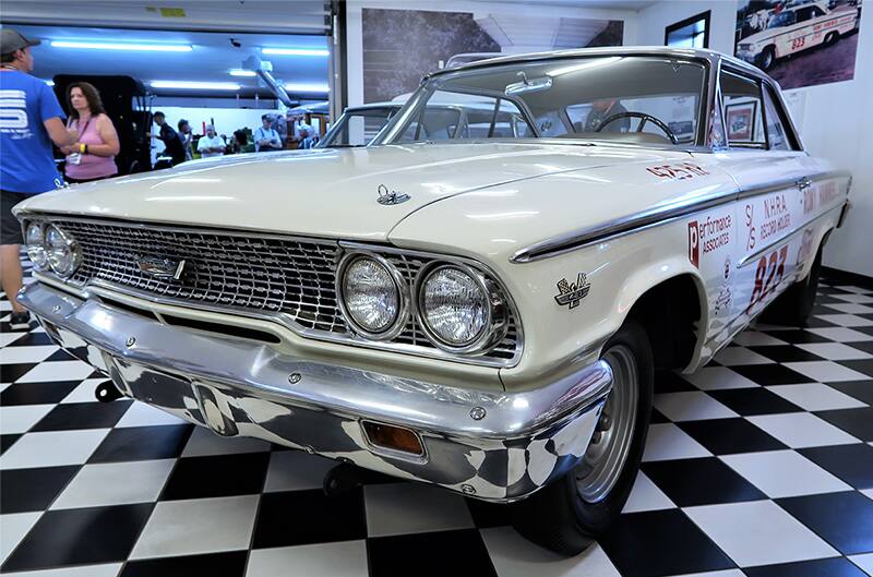 Close up front of a white Thunderbolt in a garage