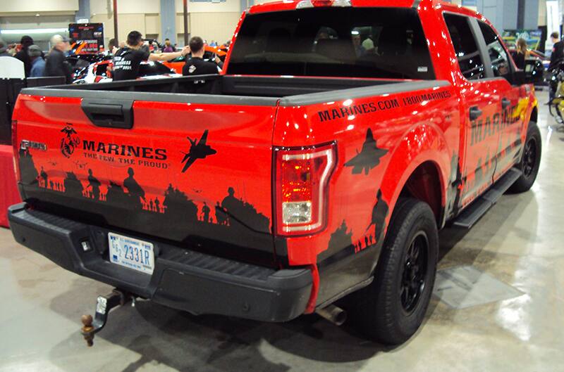 Rear of a red and black Marines painted F150 on display