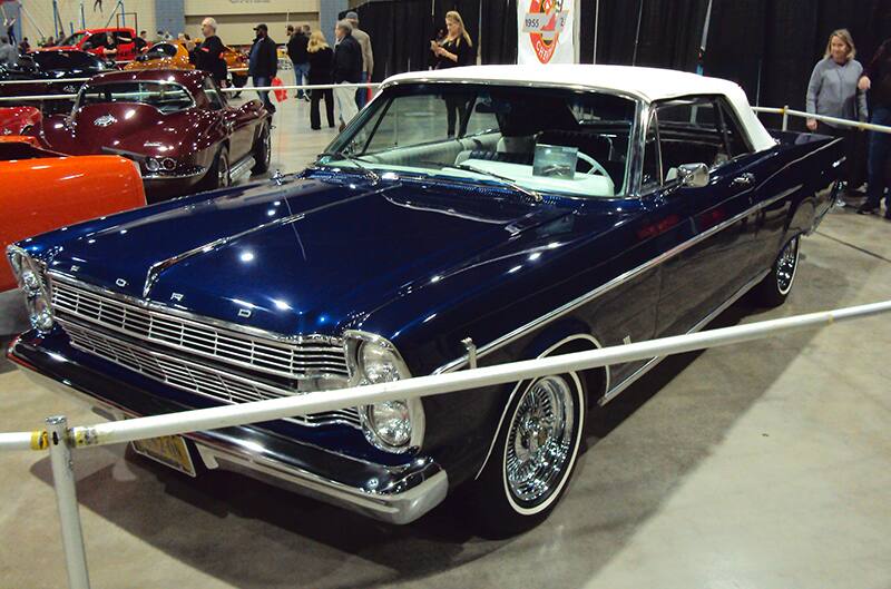 Front of a blue Mustang on display