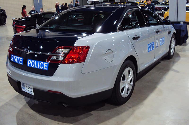 Rear of a navy blue and gray state police car