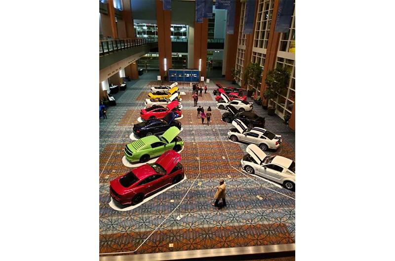 Overhead shot of various Mustangs lined up on display