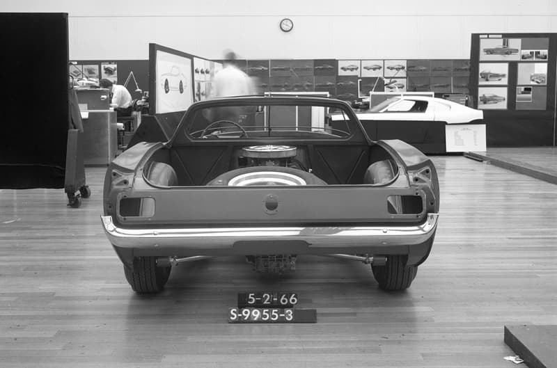 A rear end view of a 2-seater Mustang on display