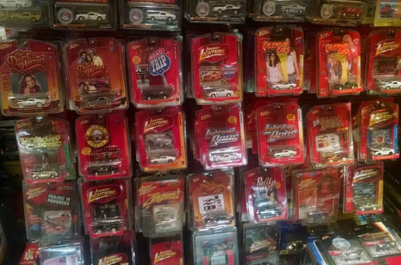 Wall of various toy cars hanging