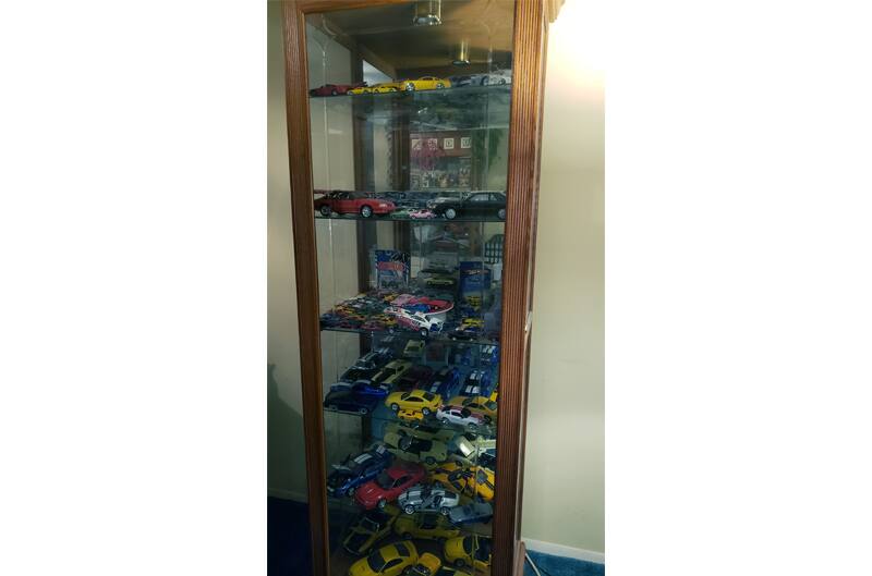 Glass Cabinet filled with Diecast Cars