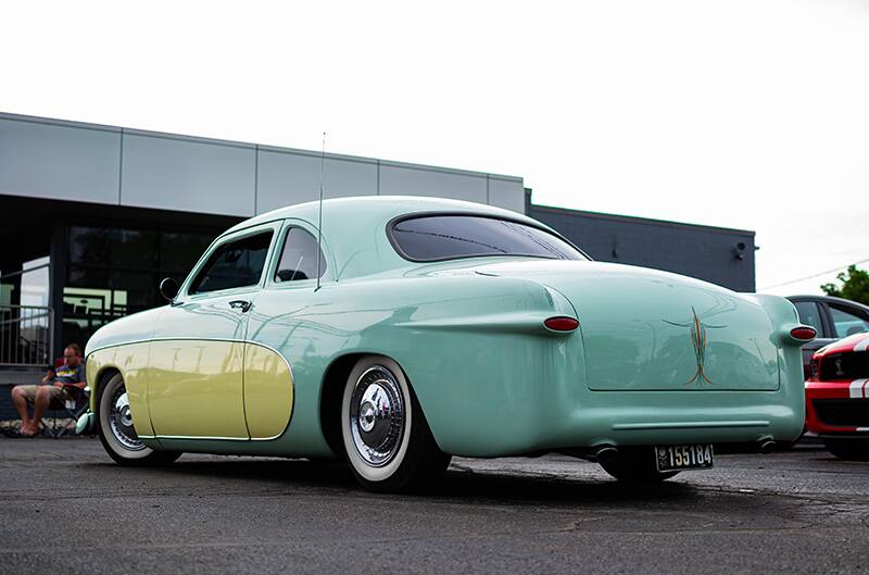 Blue and yellow Ford sedan