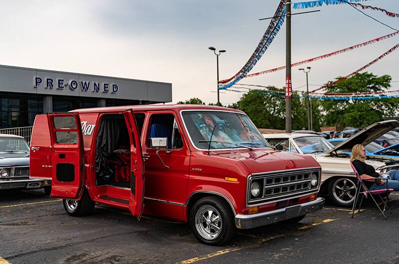 Red Ford Van with side doors open