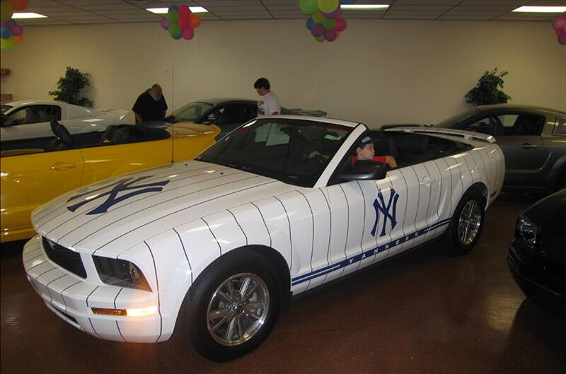 Dennis' nephew behind the wheel of yankee mustang