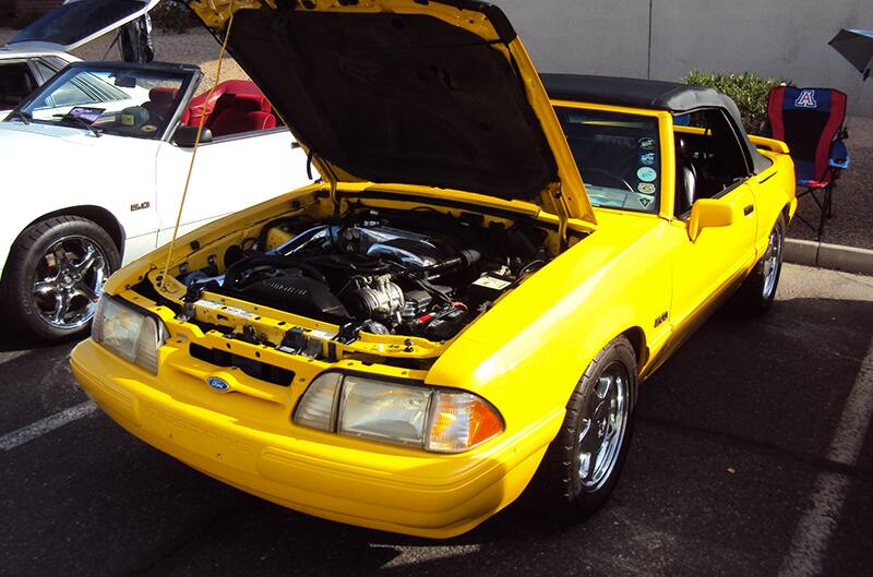 Yellow Foxbody Mustang with hood open