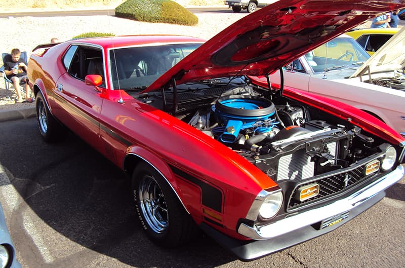 1970's red Mustang with hood open