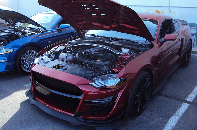 Red mustang with hood open