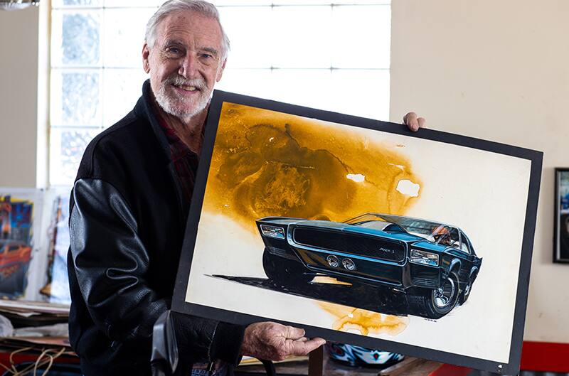 Legendary Hot Wheels designer Larry Wood, who was a Ford Designer in 1966, holds up one of his never-before-seen Ford concept sketches of the Mach 1 as he remembers Charles McHose