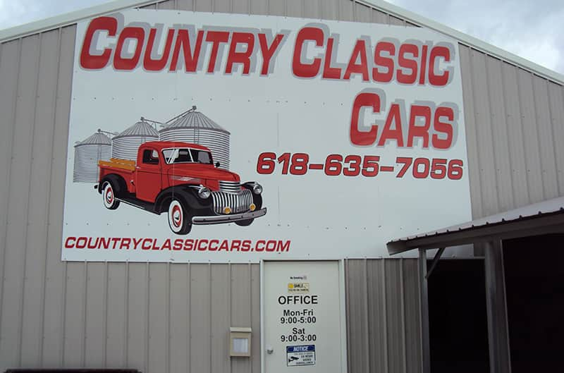 Country Classic Cars sign on side of barn