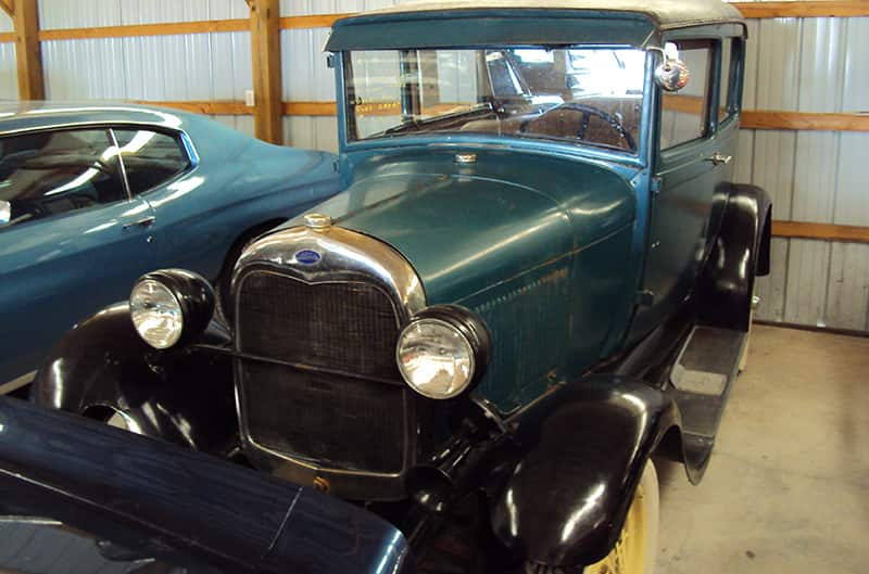 Teal 1930s Ford stored inside