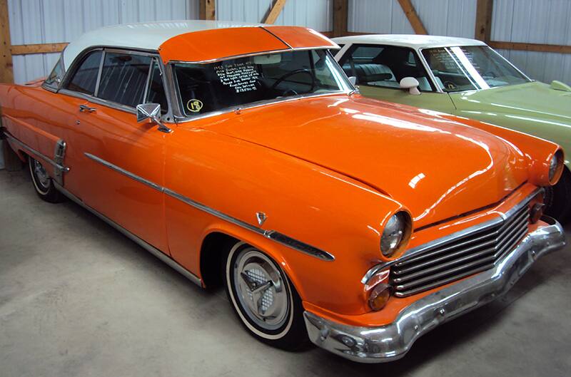 Orange 1960s Ford with white top