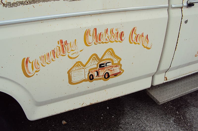 Country Classic Cars logo on the side of 90s F150