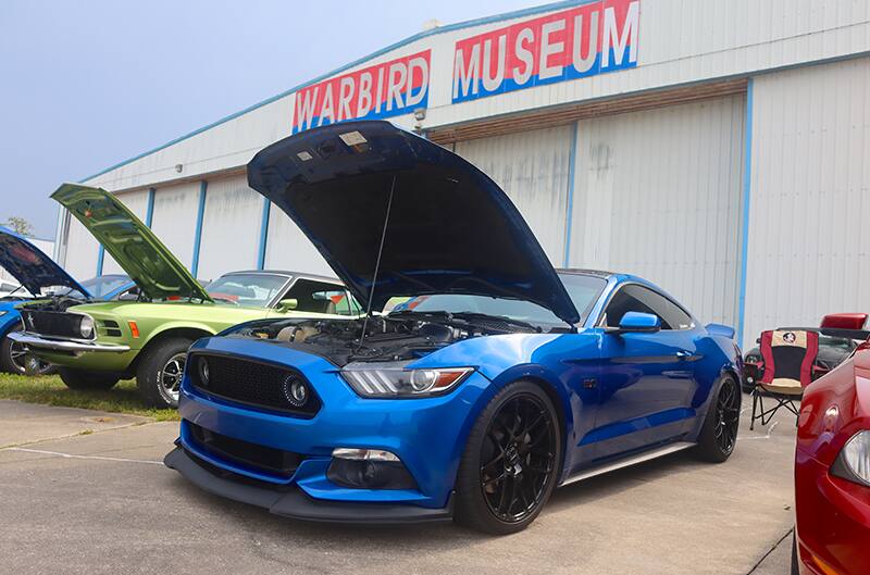 Blue S550 Mustang with hood open at car show