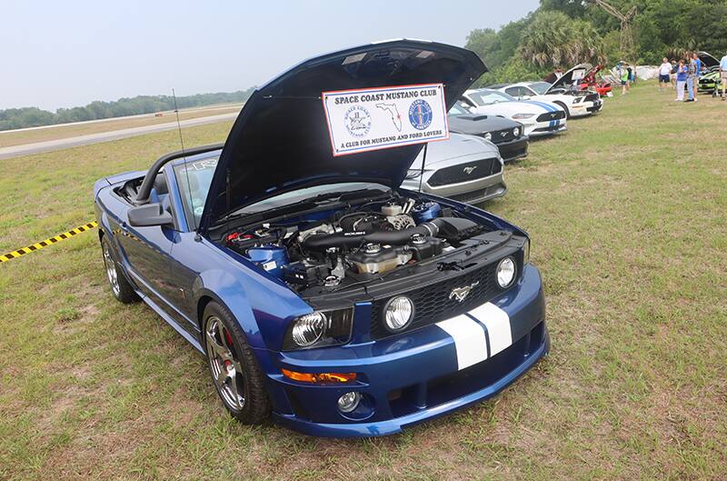 Blue S197 Mustang with white stripes and hood open