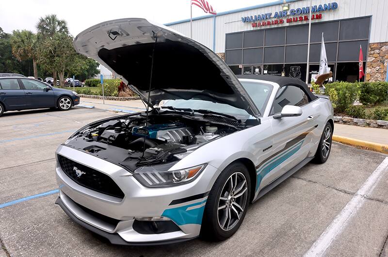 Silver S550 Mustang with custom vinyl along side