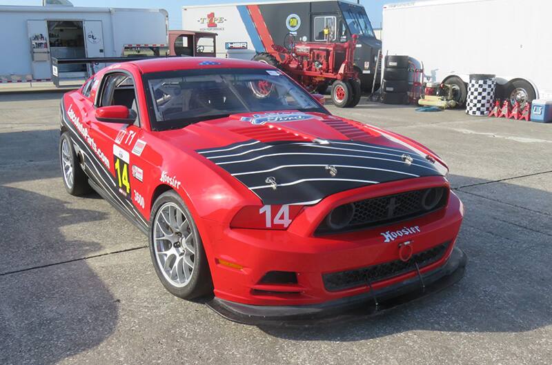 Red S197 Racecar heading to track