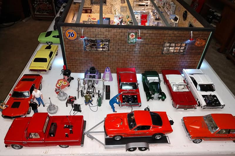 Exterior of shop with many 1 18th scale fords surronding