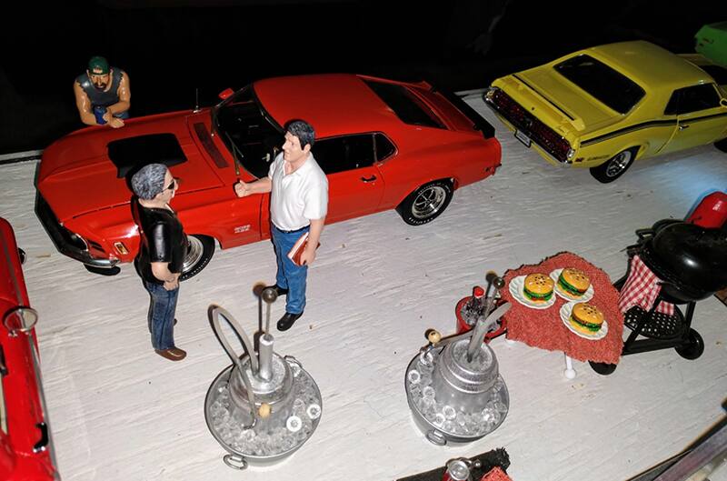 model people standing around model 1970 Mustang