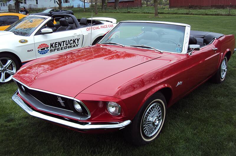 Red 1968 Mustang Convertible with top down