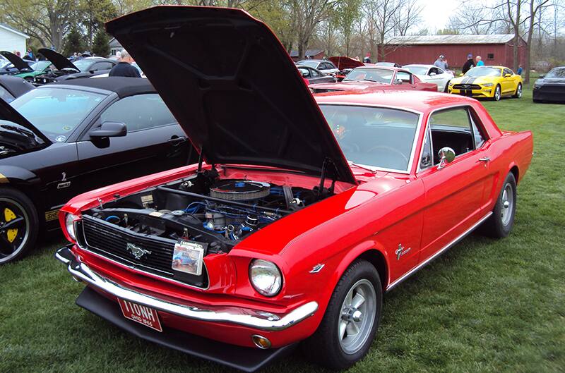 Red 1966 Mustang hardtop with hood open