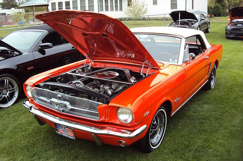 Bright orange custom 1966 Mustang with hood up