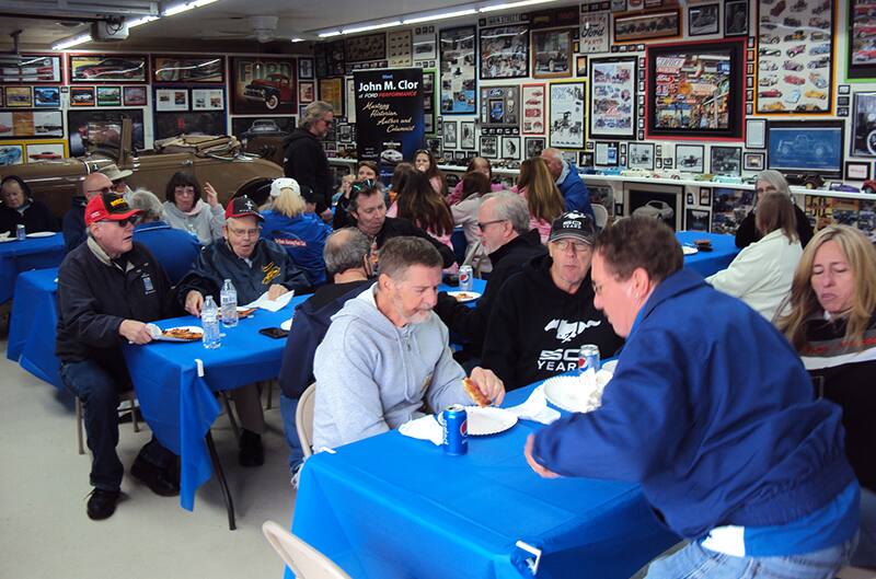 Group of people sitting at tables inside Halderman Barn