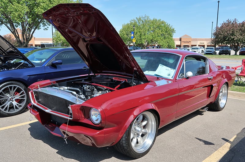 Red 1966 Mustang with hood open