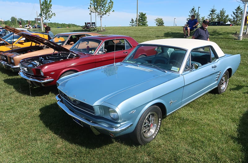 Various 1960s Ford Mustangs at show