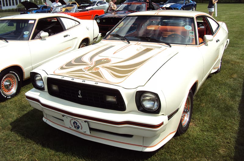 White mustang II with decals on hood