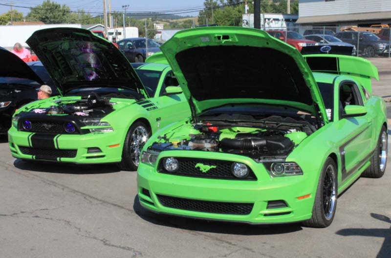 2 Green Mustangs