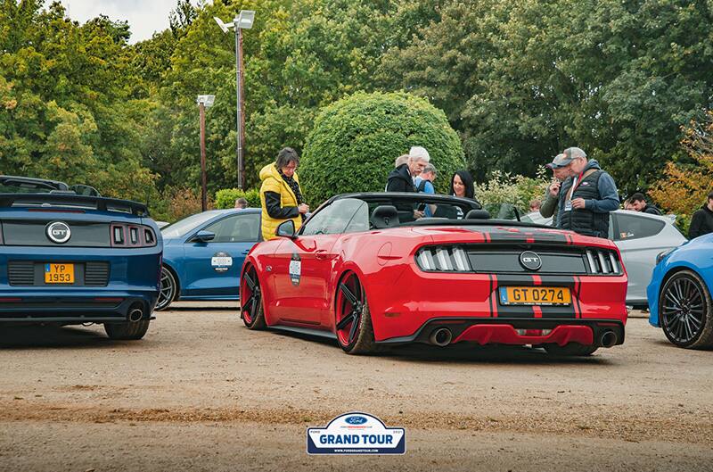 Red S550 mustang from behind