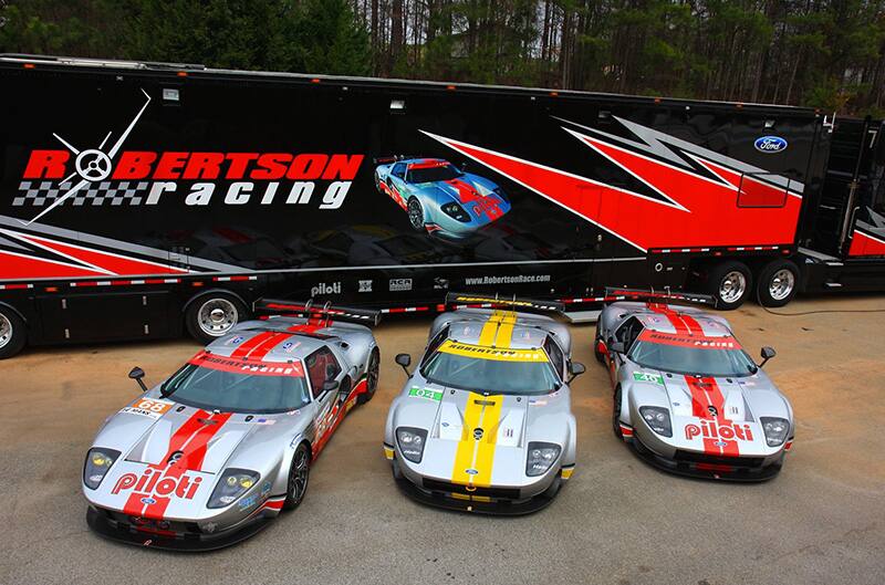 Silver and Yellow ford GT on track