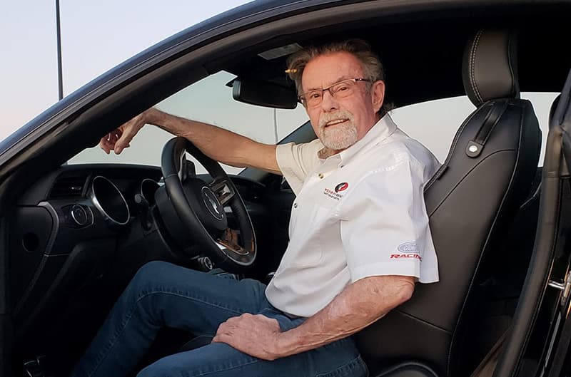 Kenny Brown sitting in driver seat of Mustang