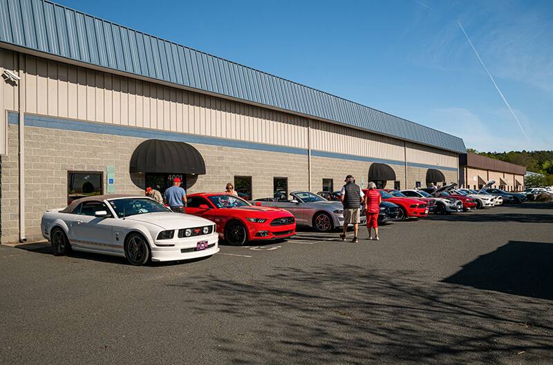 Mustangs parked outside museum